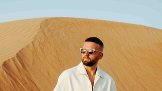 Sunset desert landscape with a man in sunglasses on Partybody.